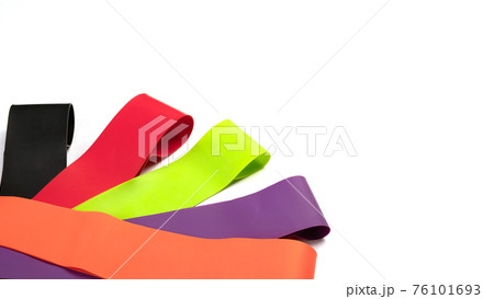 Banner fitness, gym concept. Elastic expanders for sports training isolated. Set of colorful latex rubber bands for fitness on white background. Banner fitness, gym concept. Elastic expanders for sports training isolated. Set of colorful latex rubber bands for fitness on white background. 76101693