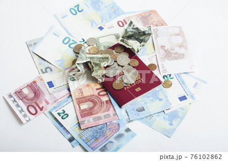 Cash on table isolated: dollars, euro, rubl broken money. All in mess, global crisis . passport travel concept Cash on table isolated: dollars, euro, rubl broken money. All in mess, global crisis . passport travel concept 76102862