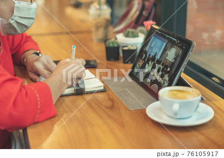 Business woman wear surgical mask to prevent spread Coronavirus (Covid 19) and team work using Laptop Computer with Webinar E-business Browsing Connection and cloud online technology. Selective focus. Business woman wear surgical mask to prevent spread Coronavirus (Covid 19) and team work using Laptop Computer with Webinar E-business Browsing Connection and cloud online technology. Selective focus. 76105917