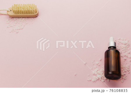 Bottle of cosmetic oil and brush on pink background Bottle of cosmetic oil and brush on pink background 76108835