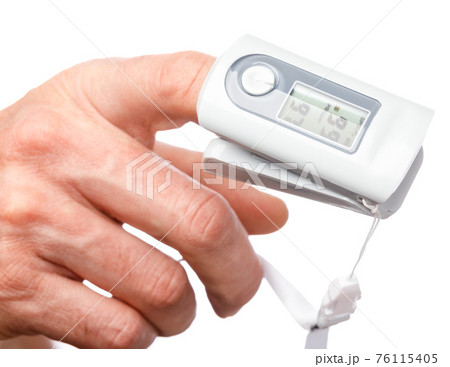 Person using pulse oximeter to check oxygen saturation tracking coronavirus symptoms at home Person using pulse oximeter to check oxygen saturation tracking coronavirus symptoms at home 76115405