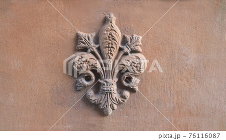 lily symbol of Florence in relief on a old terracotta tile lily symbol of Florence in relief on a old terracotta tile 76116087