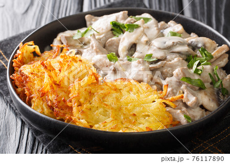 Zurich Geschnetzeltes a classic Swiss Veal Dish closeup in the plate. Horizontal 76117890