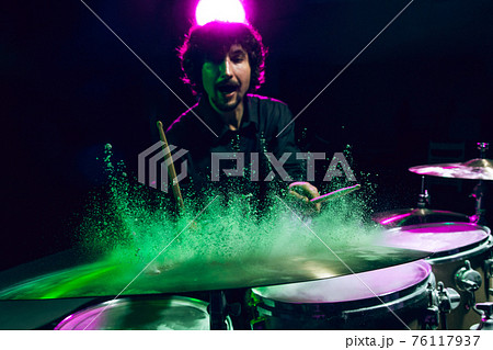 Drummer's rehearsing on drums before rock concert. Man recording music on drumset in studio 76117937