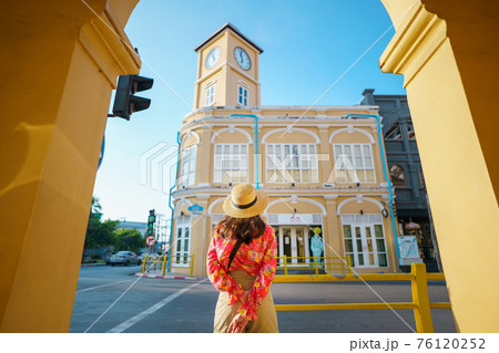 Travelers on street Phuket old town with Building Sino Portuguese architecture at Phuket Old Town area Phuket, Thailand. Travel concept 76120252