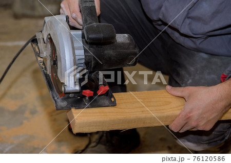 Circular saw carpenter using for wood beam Circular saw carpenter using for wood beam 76120586