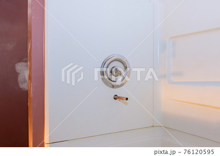 Home construction with copper pipe in the wall on new tap bathroom 76120595