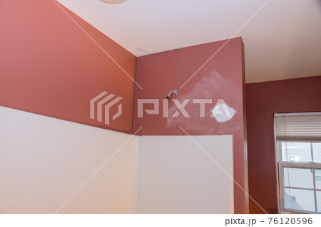 Plumbing installing copper pipe in the wall on new mixer bathroom 76120596