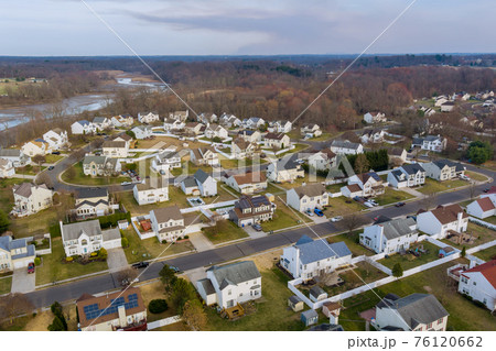 Aerial view on the residential streets landscape early spring of a small town Aerial view on the residential streets landscape early spring of a small town 76120662