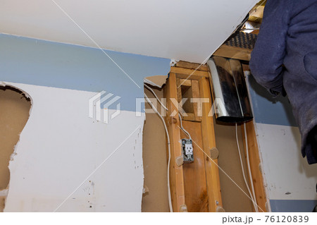 Ducts for heating system the ceiling mounted on under construction of ventilation pipe system in kitchen interior installation 76120839