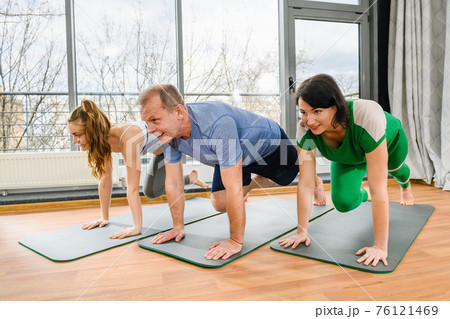 Group sport yoga fitness plank exercise indoors Group sport yoga fitness plank exercise indoors 76121469