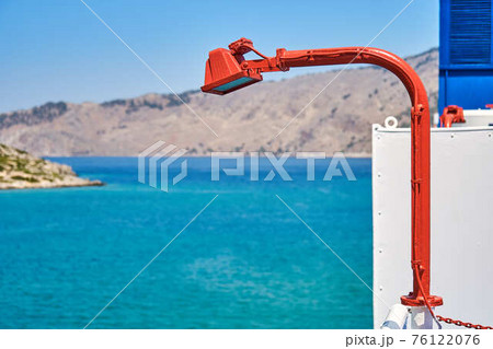 Large spotlight of red colour located on vessel board Large spotlight of red colour located on vessel board 76122076