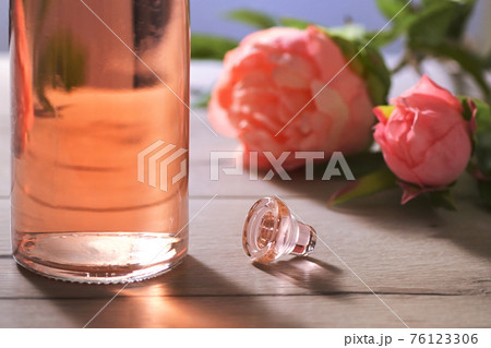 Bottle Of Pink Rose Wine and Spring Flowers 76123306
