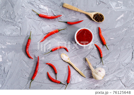 Red hot chili grey concrete background. Natural homemade peppers. 76125648