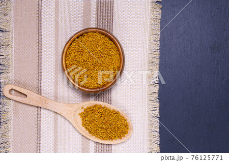 seeds medicinal plant fenugreek on a wooden light table closeup. shambala grains for use in alternative medicine. copyspace seeds medicinal plant fenugreek on a wooden light table closeup. shambala grains for use in alternative medicine. copyspace 76125771