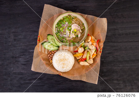 Complex lunch with warm meat salad, soup and boiled rice Complex lunch with warm meat salad, soup and boiled rice 76126076