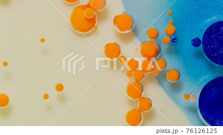 Bubbles float in liquid paint, mixing ink, oil and milk, abstract multicolor hypnotic painting 76126125