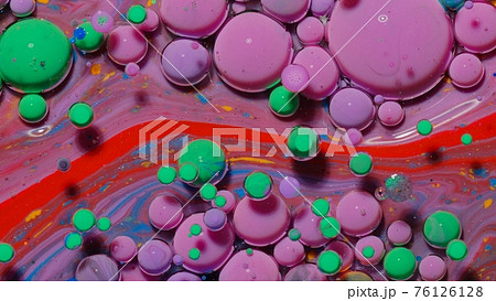 Top view movement of red oil ink drops bubbles, multicolored artistic paint surface background 76126128