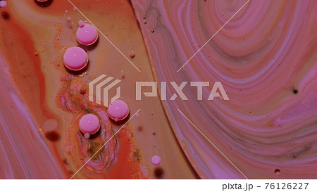 Top view movement of pink oil ink drops bubbles, multicolored artistic paint surface background 76126227