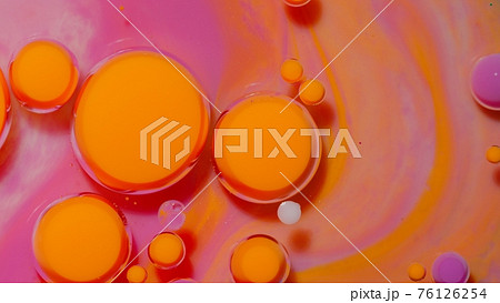 Bubbles float in liquid paint, mixing ink, oil and milk, abstract multicolor hypnotic painting 76126254