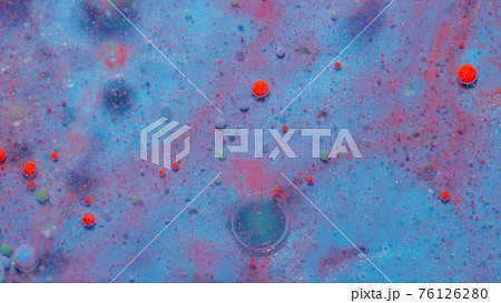 Ink bubbles mixed with liquid substance of oil, milk, soap, bright acrylic paint on colorful surface 76126280
