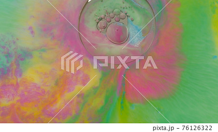 Top view to beautiful combination of paint and ink in milk, oil and soap, abstract colorful painting 76126322