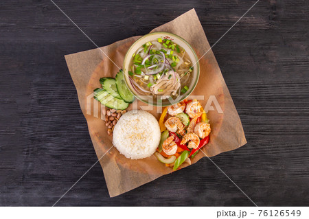 Boiled shrimp with sesame and vegetables, served with rice and meat soup with greens Boiled shrimp with sesame and vegetables, served with rice and meat soup with greens 76126549