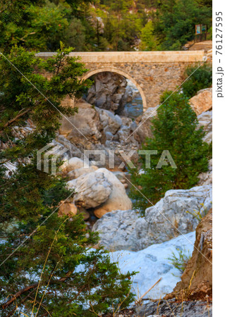 Ancient stone bridge across a mountain river in Kesme Bogaz canyon, Antalya province in Turkey Ancient stone bridge across a mountain river in Kesme Bogaz canyon, Antalya province in Turkey 76127595