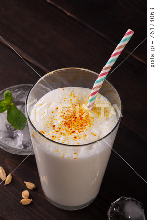 Lassi is a popular traditional dahi, yogurt based cold drink in India, close up Lassi is a popular traditional dahi, yogurt based cold drink in India, close up 76128063