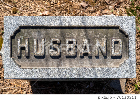 Close up of Husband cemetery grave stone Close up of Husband cemetery grave stone 76130511