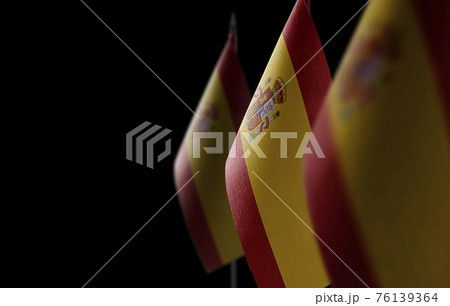 Small national flags of the Spain on a black background 76139364