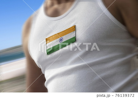 The national flag of India on the athlete's chest The national flag of India on the athlete's chest 76139372