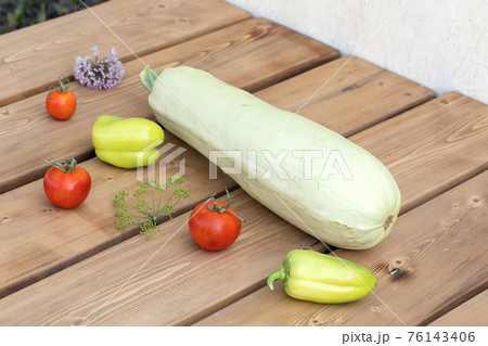 Fresh raw vegetables on wooden table. Seasonal organic farm products. 76143406