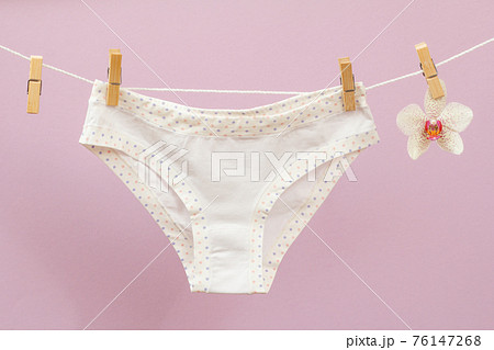 Beautiful women cotton panties on lilac background. Beautiful women cotton panties on lilac background. 76147268