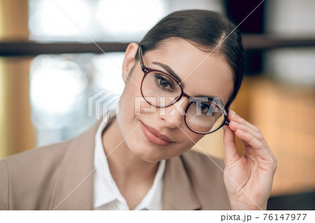 Close up of a pretty woman in eyewear 76147977