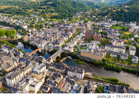 Flight over the city Espalion and river Lot on day. France 76148265