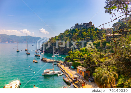 beautiful colorful view Gulf of Portofino Italy with castle Brown in background and boats anchored beautiful colorful view Gulf of Portofino Italy with castle Brown in background and boats anchored 76149030