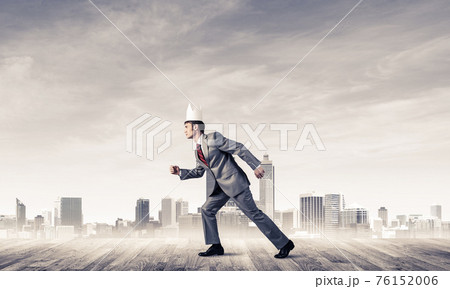 King businessman in elegant suit running and modern cityscape at King businessman in elegant suit running and modern cityscape at 76152006