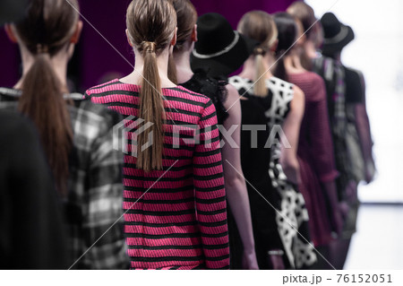 Fashion Show, Catwalk Runway Event, Fashion Week themed photograph. Models walking fashion show finale. 76152051
