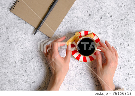 Coffee in a cup, cookies and notepad 76156313