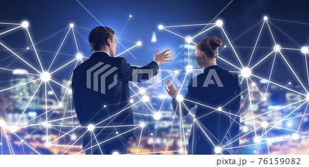 Concept of social connection and networking against night city view and partners working in cooperation 76159082