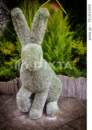Design Easter decor park installed sculpture rabbit with standing ears vertical photo Design Easter decor park installed sculpture rabbit with standing ears vertical photo 76163409