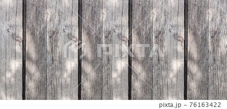 gray faded boards in sunlight vertical stripes background gray faded boards in sunlight vertical stripes background 76163422