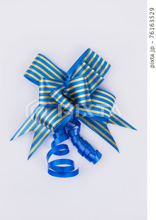 Festive gift bow of blue color. Festive gift bow of blue color. 76163529