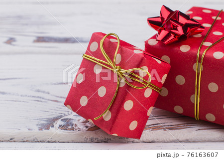 Red with white polka dots gift boxes. Red with white polka dots gift boxes. 76163607