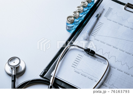 Statistics covid. Doctor stethoscope, hospital healthcare infographic charts and analytic medical statistics on hospital background. Global economy recovery after Covid 19 concept. Statistics covid. Doctor stethoscope, hospital healthcare infographic charts and analytic medical statistics on hospital background. Global economy recovery after Covid 19 concept. 76163793