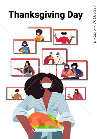 woman in mask discussing with family during video call people celebrating happy thanksgiving day 76166137