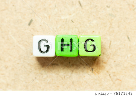 Color alphabet letter block in word GHG (Abbreviation of greenhouse gas) on wood background Color alphabet letter block in word GHG (Abbreviation of greenhouse gas) on wood background 76171245