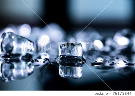 ice cubes reflection on black background. close up 76175844
