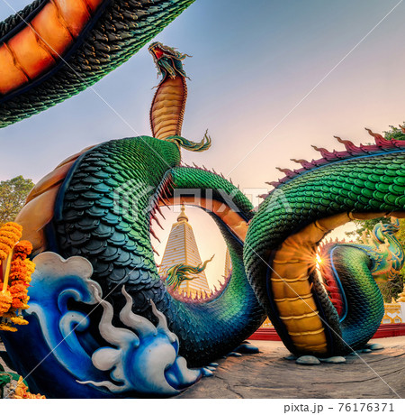 Rainbow carve serpent or colorful Thai Naga surrounding Sri Maha Pho Chedi stupa in the sunset at Wat Phra That Nong Bua Rainbow carve serpent or colorful Thai Naga surrounding Sri Maha Pho Chedi stupa in the sunset at Wat Phra That Nong Bua 76176371